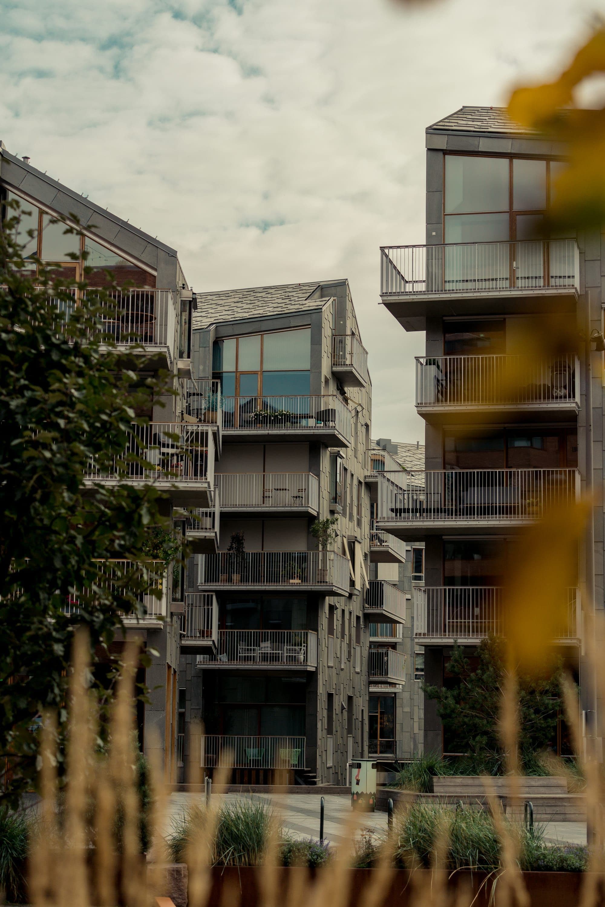 Modern residential buildings in Bjorvika with greenery